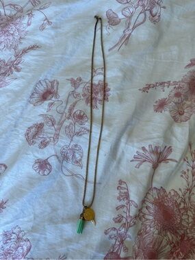Gold-Tone Necklace with Green Tassel Charm